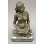 A bronze model of a naked lady. 35 cm high.