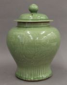 A Chinese celadon ground lidded ginger jar. 29 cm high.