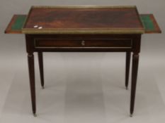 A Victorian brass mounted mahogany silver table. 81 cm wide.