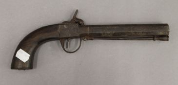 A 19th century percussion pistol. 28 cm long.