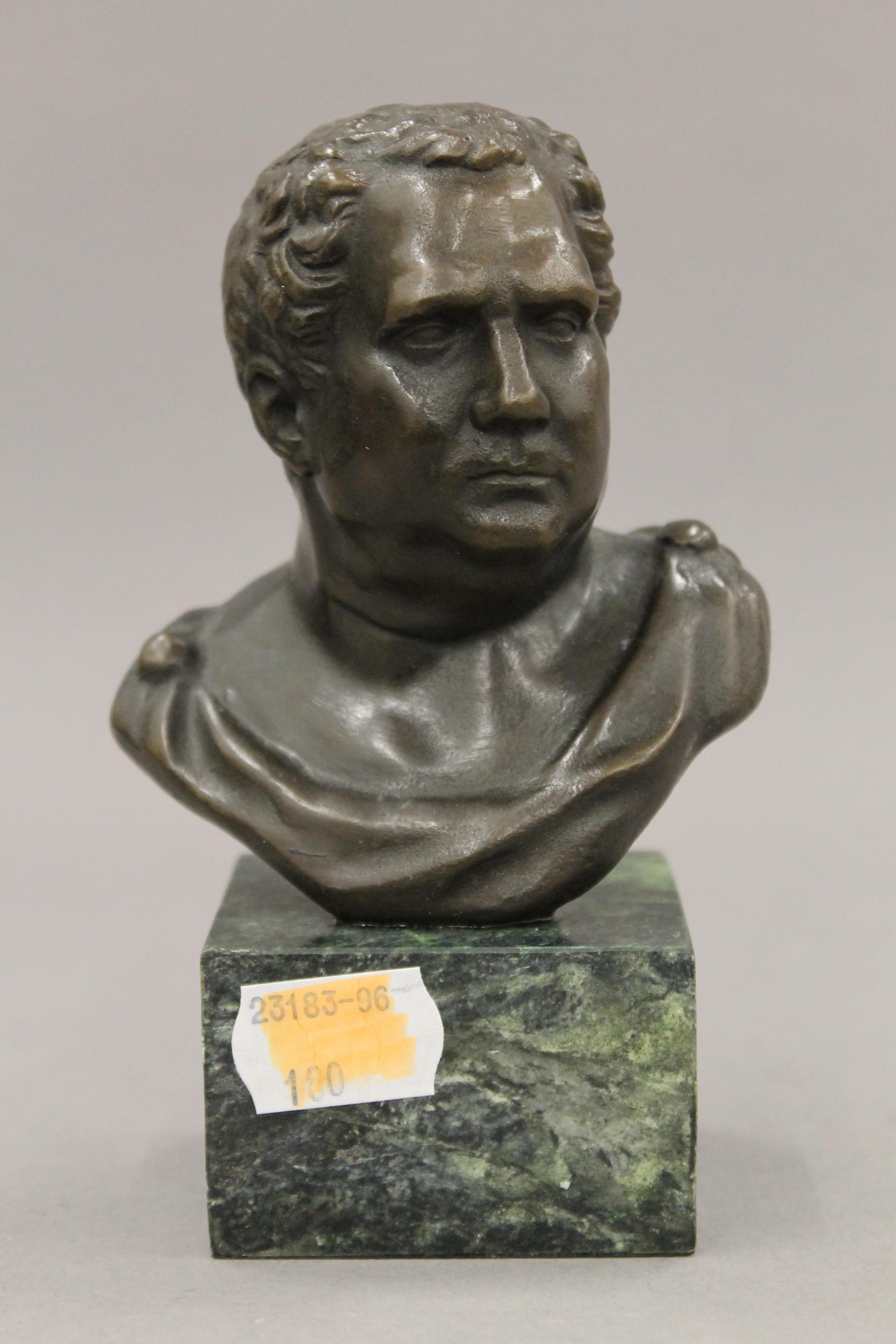A small bronze bust of a classical figure. 14 cm high.