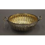 A silver twin handled bowl. 18.5 cm diameter including handles. 8.8 troy ounces.