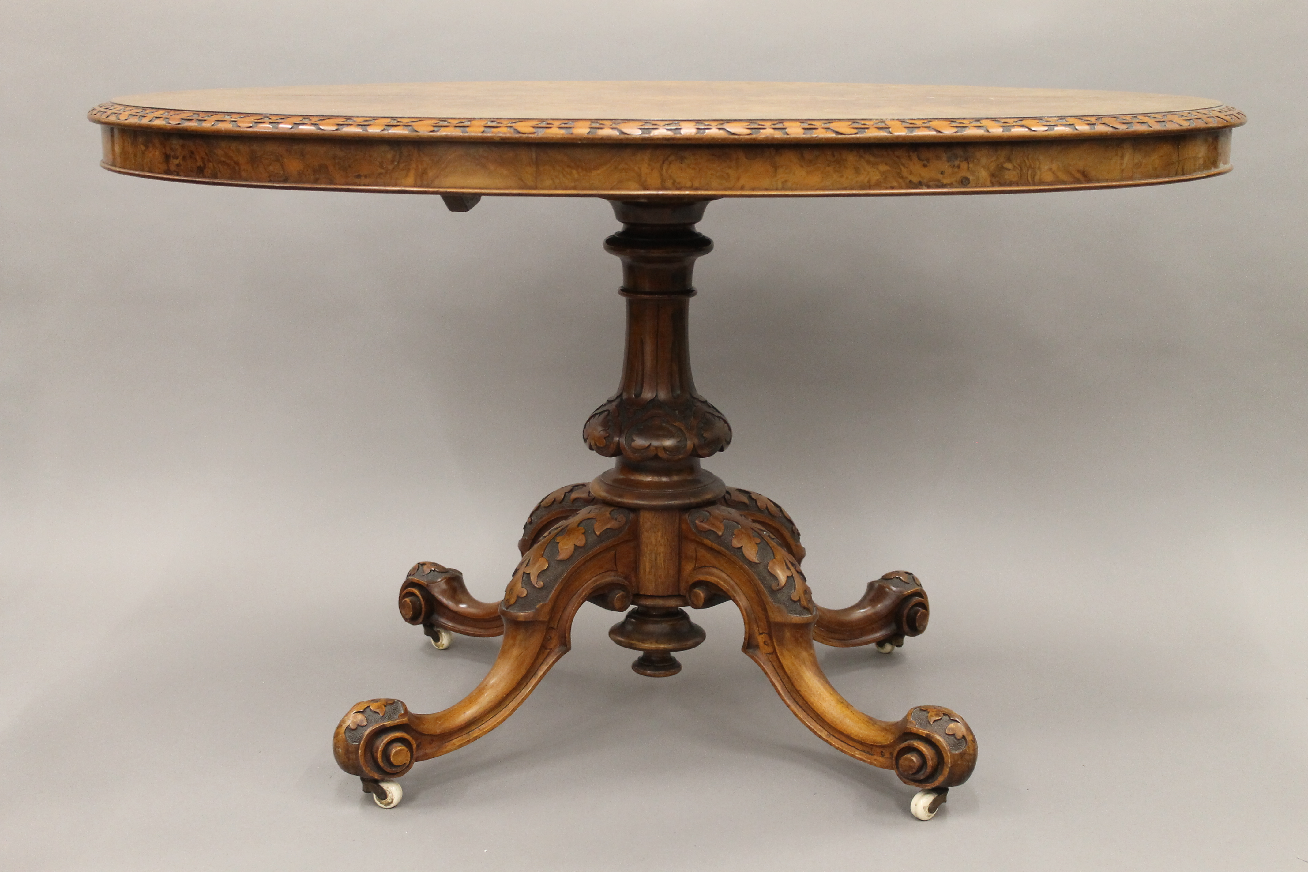 A burr walnut loo table with floral carved border. 122 cm long. - Image 2 of 6