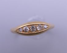 A 9 ct gold 5 stone diamond ring. 4.7 grammes total weight.