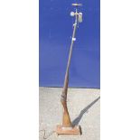 A 19th century rifle formed as a standard lamp. 149 cm high overall.