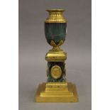A gilt metal mounted urn form candlestick in the style of MATTHEW BOULTON. 21 cm high.