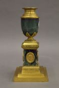 A gilt metal mounted urn form candlestick in the style of MATTHEW BOULTON. 21 cm high.