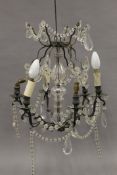 A vintage cut glass chandelier. Approximately 50 cm high.