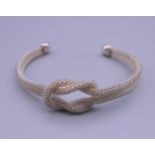 A 925 silver torque knot bracelet. 7.5 cm wide.
