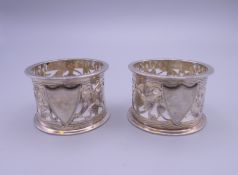 Two silver napkin rings.