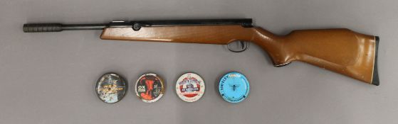 A Webley Tracker air rifle and pellets. 93 cm long.