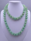 A string of jade beads. Approximately 84 cm long.