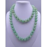 A string of jade beads. Approximately 84 cm long.