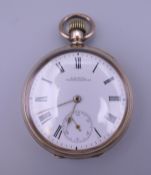 A Waltham USA top wind open face gold plated pocket watch. 5 cm diameter. Good working order.