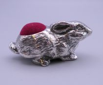 A silver pin cushion formed as a rabbit. 2.5 cm high.