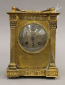 A 19th century French brass cased mantle clock. 24 cm high.