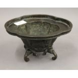 A Chinese patinated bronze lobed censer. 20.5 cm wide.