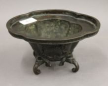 A Chinese patinated bronze lobed censer. 20.5 cm wide.