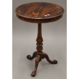 A 19th century rosewood tripod table. 51 cm diameter.