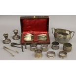 A quantity of various silver items, including napkin rings, candlesticks, etc. 11.