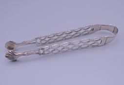 A pair of 18th century silver sugar tongs, possibly by maker John Schofield. 13.5 cm long.