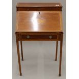 An Edwardian inlaid mahogany bonheur du jour. 61 cm wide.