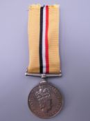 A British Military Elizabeth II Iraq medal awarded to 25061529 LCPL T Hughes RLC.