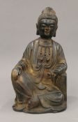 A Chinese bronze model of Buddha holding a scroll. 22.5 cm high.