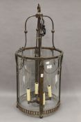 A glazed hanging lantern. 84 cm high.