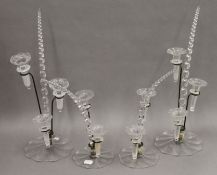 Four small clear glass epergnes. The largest 41 cm high.