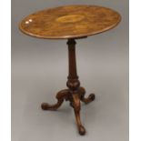 A Victorian inlaid walnut tripod table. 60 cm wide.