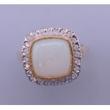 An Art Deco style 9 ct gold opal and diamond ring. Ring size O/P.