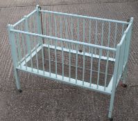 A large vintage child's cot. 137 cm wide.