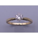 An 18 ct gold diamond solitaire ring, with EGL Report card stating diamond weight 0.