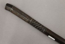 An unmarked white metal inlaid walking stick. 87.5 cm high.