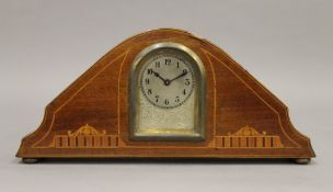An Edwardian inlaid mahogany mantle clock. 24.5 cm wide.