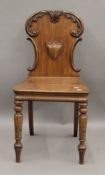 A Victorian mahogany hall chair. 42.5 cm wide.