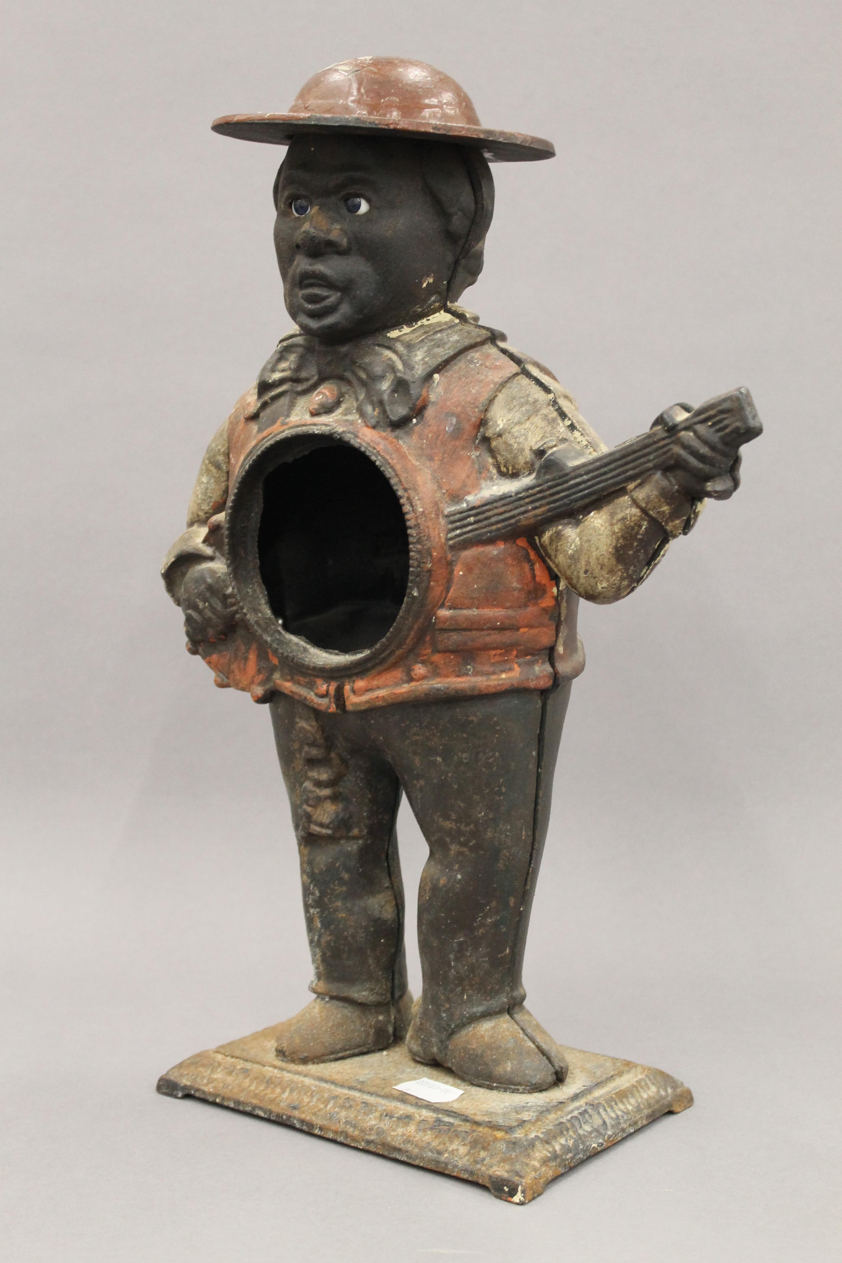 A cast iron figural clock case. 39 cm high. - Image 3 of 4