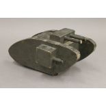 A WWI Tank Collection Box formed as a tank. 21 cm long.