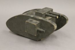 A WWI Tank Collection Box formed as a tank. 21 cm long.