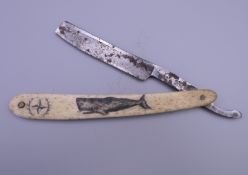 A cut throat razor with scrimshaw decoration. 16 cm long closed.