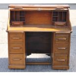 An early 20th century oak roll top desk. 116 cm wide.