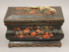 A toleware decorated unusual lined casket, with key. 25 cm wide.