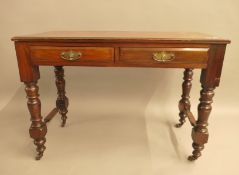 A Victorian walnut two drawer side table. 106.5 cm wide.