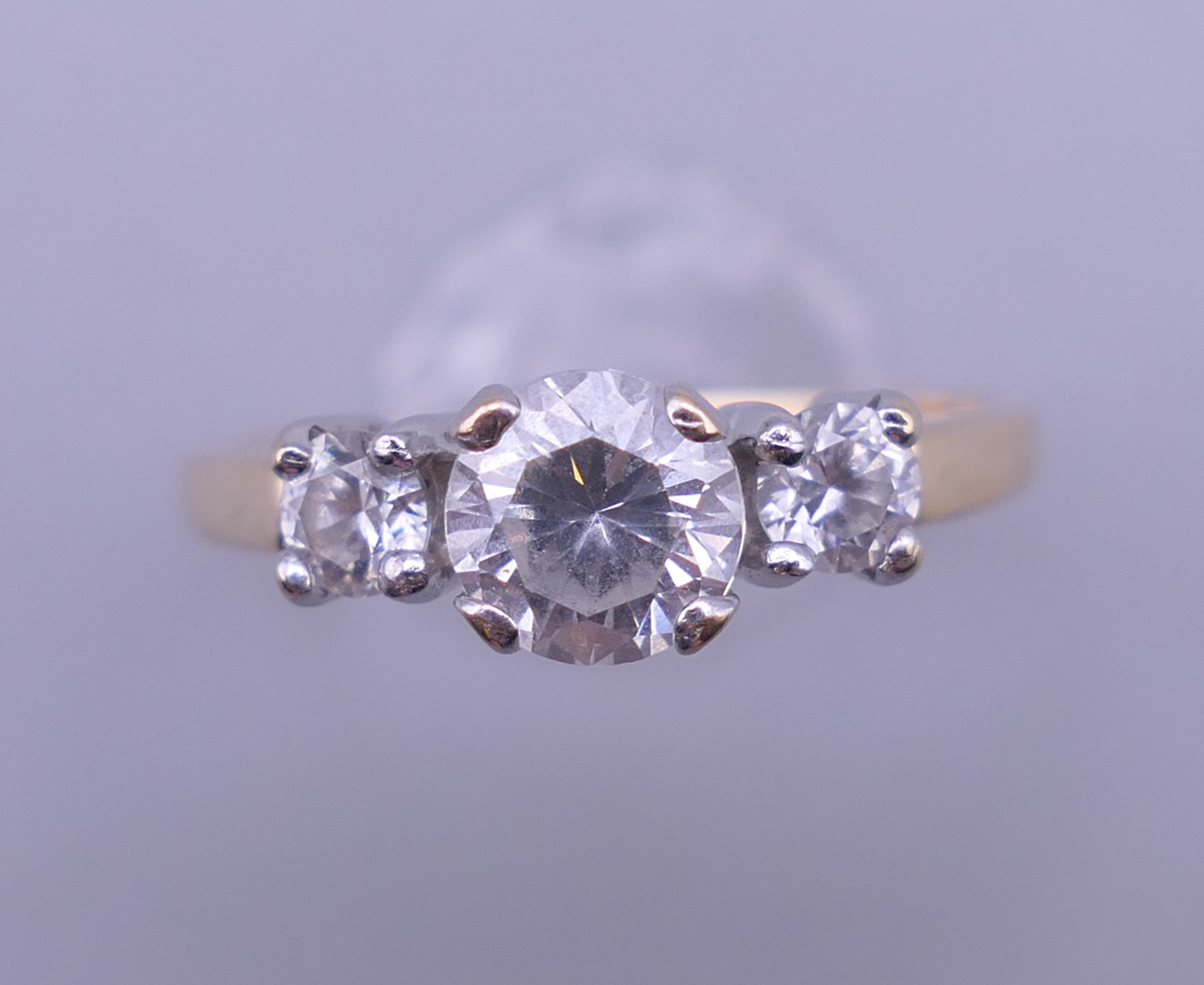 A 14 ct gold cubic zirconia ring. Ring size M. 2.5 grammes total weight.