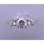 A 14 ct gold cubic zirconia ring. Ring size M. 2.5 grammes total weight.