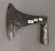 A large 17th century or possibly earlier European steel axe head. 29 cm wide.