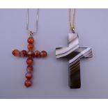 An antique banded agate hardstone cross and a faceted carnelian bead cross on a 925 silver chain.