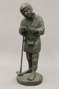 A Japanese patinated bronze model of a farmer. 31 cm high.