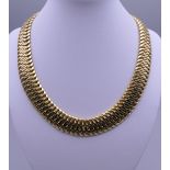 An 18 ct gold necklace. 43.5 cm long. 100.6 grammes.